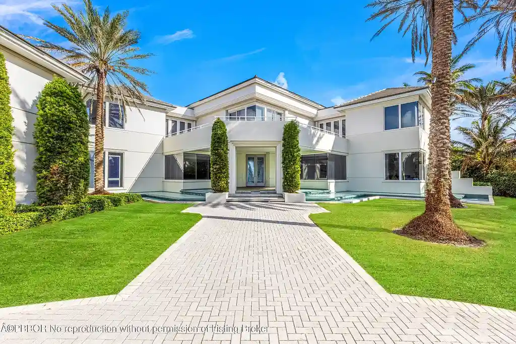 Aerial view of 1200 S Ocean Blvd Manalapan showcasing ocean-to-lake frontage, luxury estate with private pool, tennis court, and direct beach access