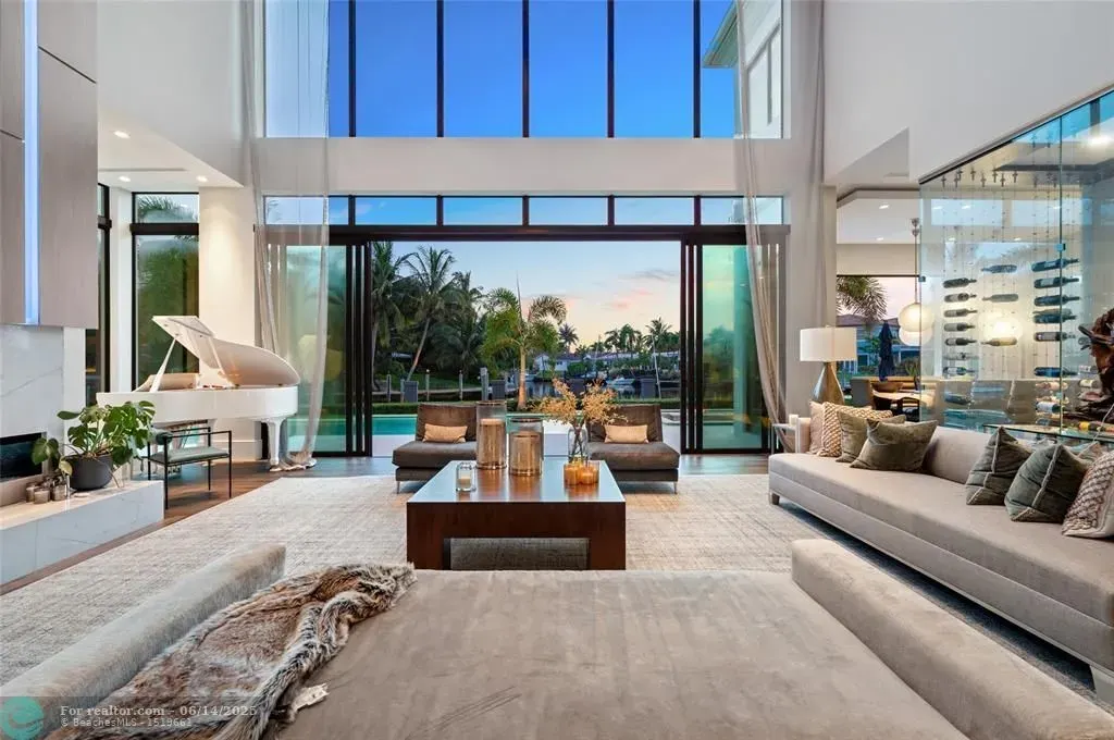 Aerial view of 1200 SE 12th Ter Deerfield Beach showcasing 245 ft waterfront, yacht dock, and saltwater pool.