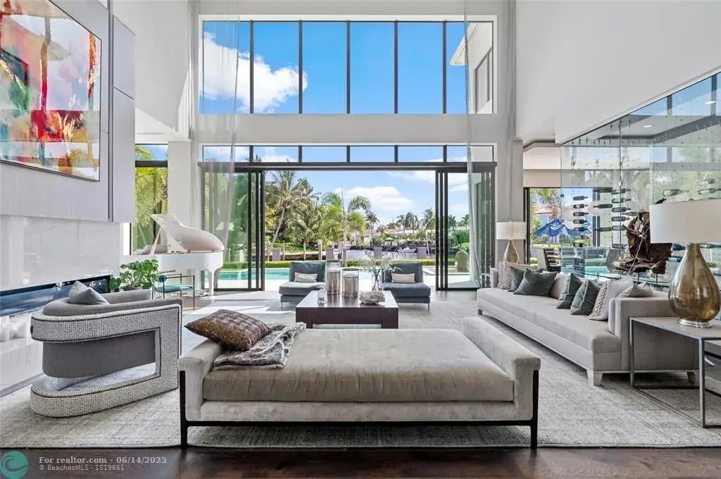 Aerial view of 1200 SE 12th Ter Deerfield Beach showcasing 245 ft waterfront, yacht dock, and saltwater pool.