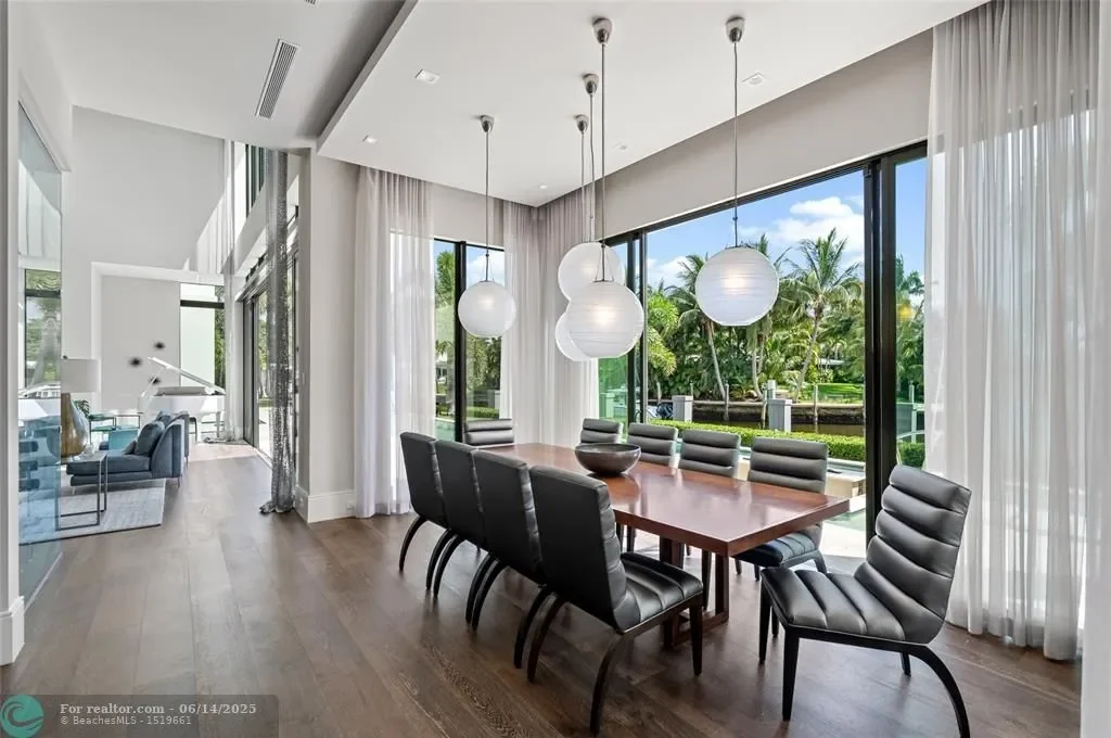 Aerial view of 1200 SE 12th Ter Deerfield Beach showcasing 245 ft waterfront, yacht dock, and saltwater pool.