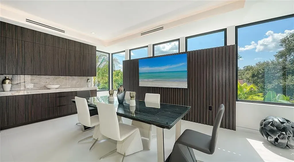 Private gym and 8-car garage at 1610 N Lodge Dr, a luxury Sarasota home with resort-style amenities and smart home features.