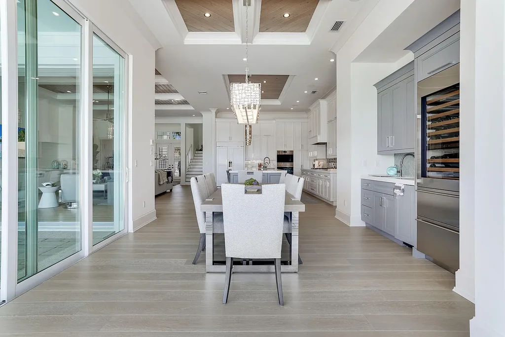 Front view of 1761 Ludlow Rd showcasing modern coastal architecture and lush landscaping in Marco Island.