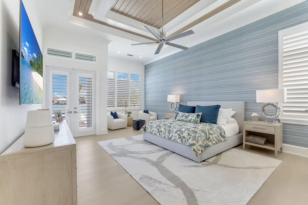 Front view of 1761 Ludlow Rd showcasing modern coastal architecture and lush landscaping in Marco Island.