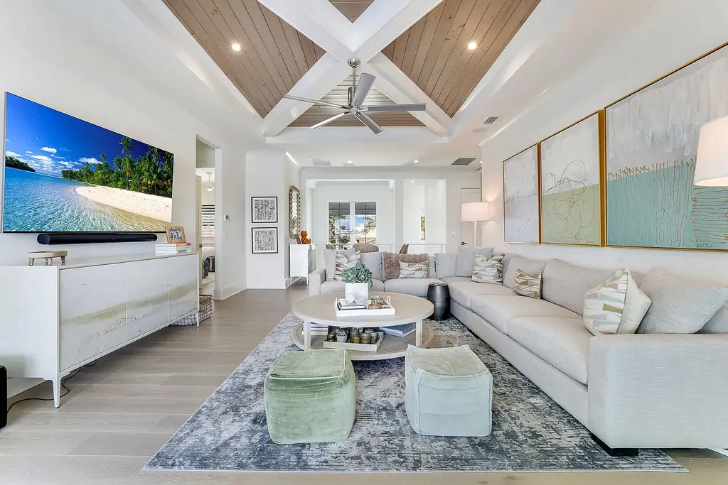 Front view of 1761 Ludlow Rd showcasing modern coastal architecture and lush landscaping in Marco Island.