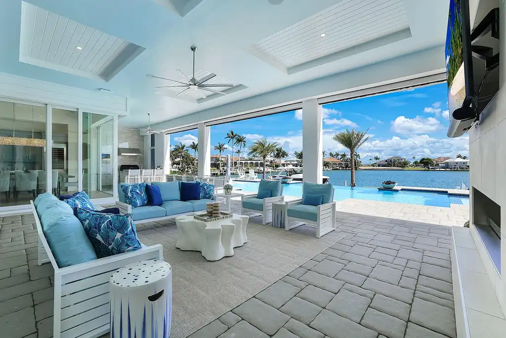 Front view of 1761 Ludlow Rd showcasing modern coastal architecture and lush landscaping in Marco Island.