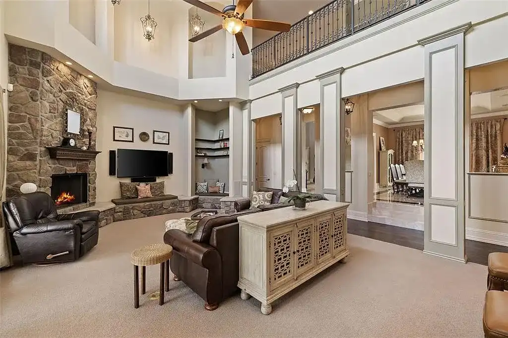 Lakefront luxury estate at 18521 Wayne Rd in Odessa FL featuring a resort-style saltwater pool, grand circular driveway, and manicured 4.75-acre grounds