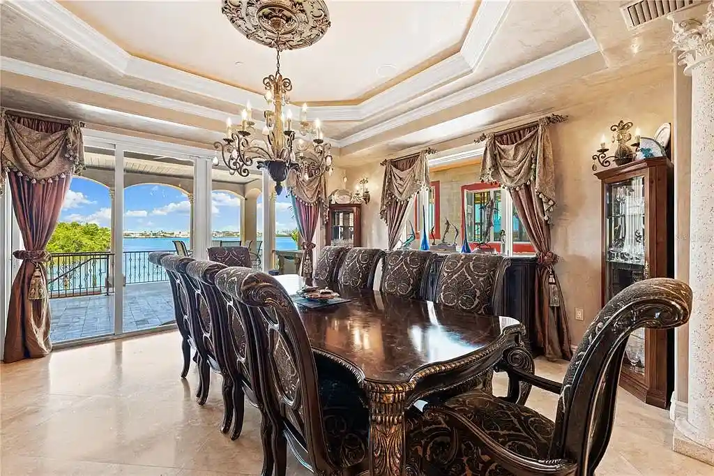 Exterior view of 290 N Washington Dr, a Mediterranean waterfront estate in Sarasota with private dock, saltwater pool, and panoramic bay views