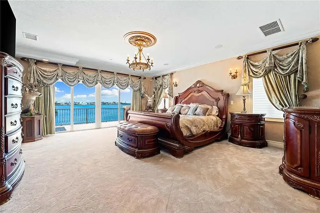 Exterior view of 290 N Washington Dr, a Mediterranean waterfront estate in Sarasota with private dock, saltwater pool, and panoramic bay views