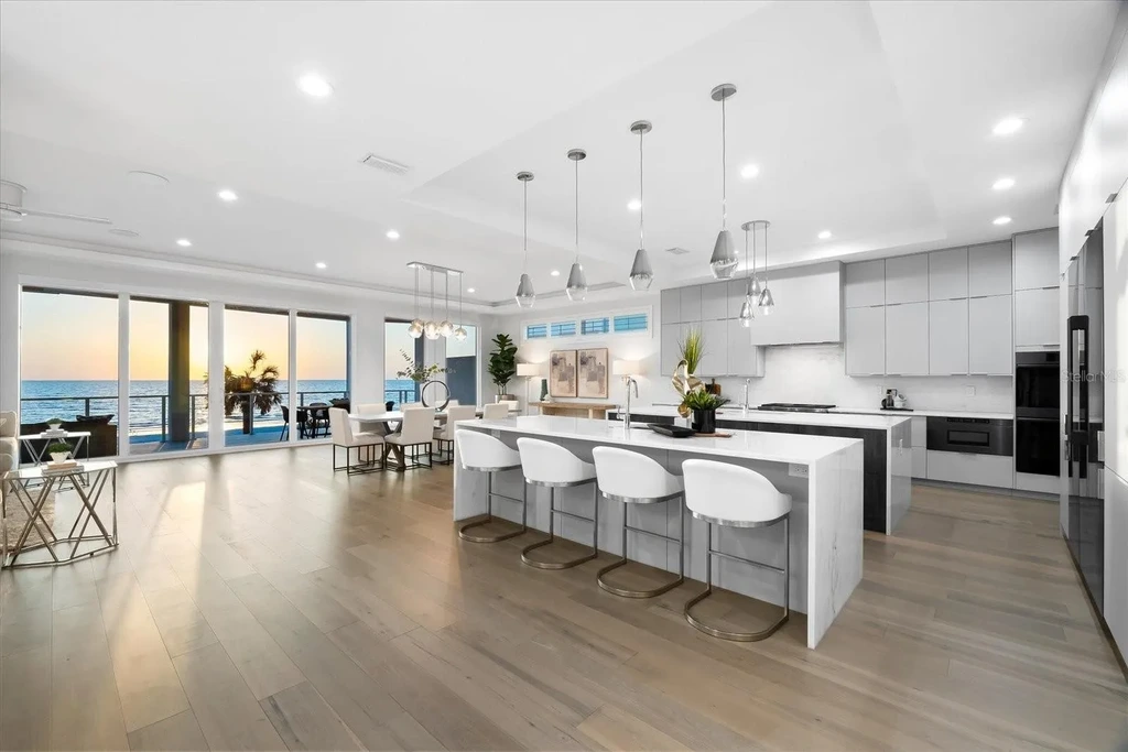 32 Gulf Blvd luxury beachfront estate in Indian Rocks Beach, FL featuring dual water frontage, modern coastal design, and private dock