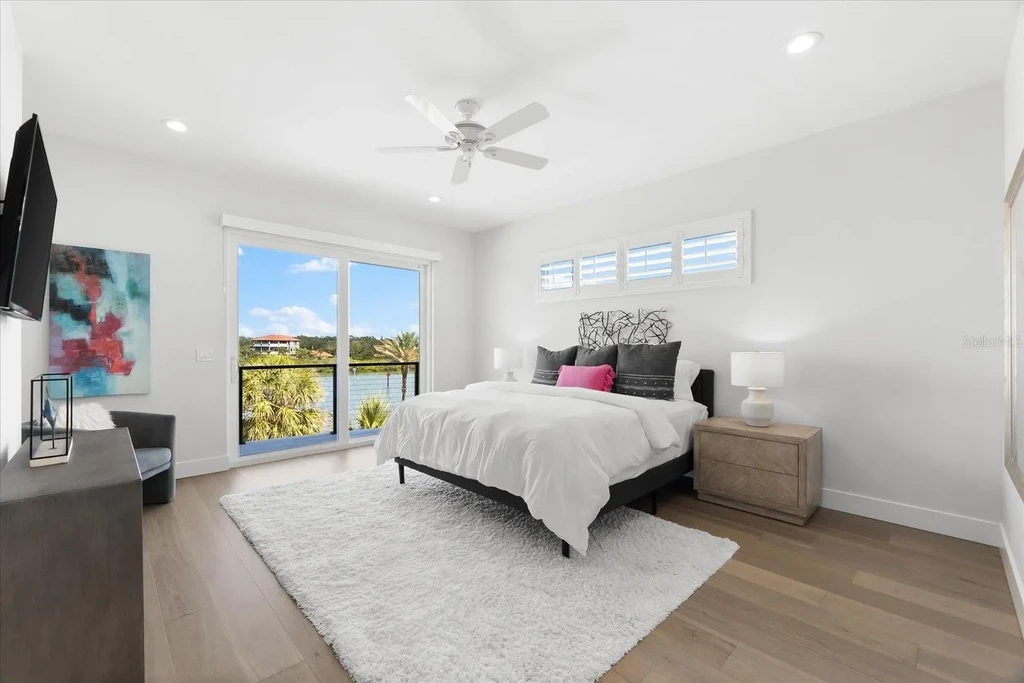 32 Gulf Blvd luxury beachfront estate in Indian Rocks Beach, FL featuring dual water frontage, modern coastal design, and private dock