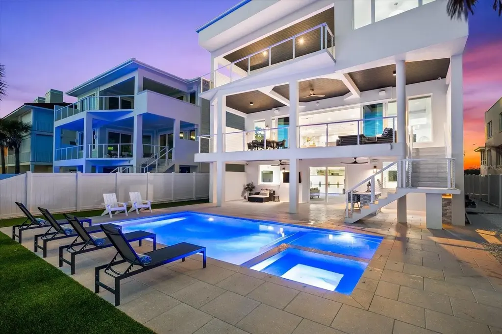 32 Gulf Blvd luxury beachfront estate in Indian Rocks Beach, FL featuring dual water frontage, modern coastal design, and private dock