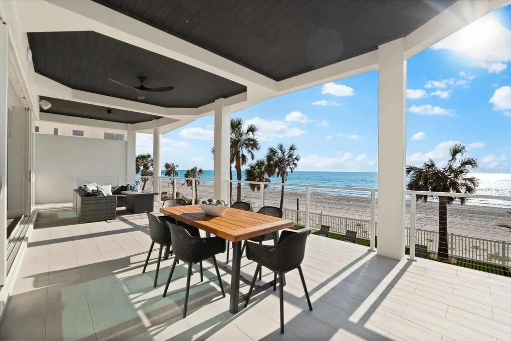 32 Gulf Blvd luxury beachfront estate in Indian Rocks Beach, FL featuring dual water frontage, modern coastal design, and private dock