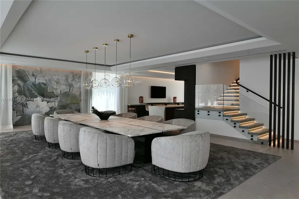 Modern waterfront mansion at 375 N Hibiscus Dr with sleek architecture and bayfront views