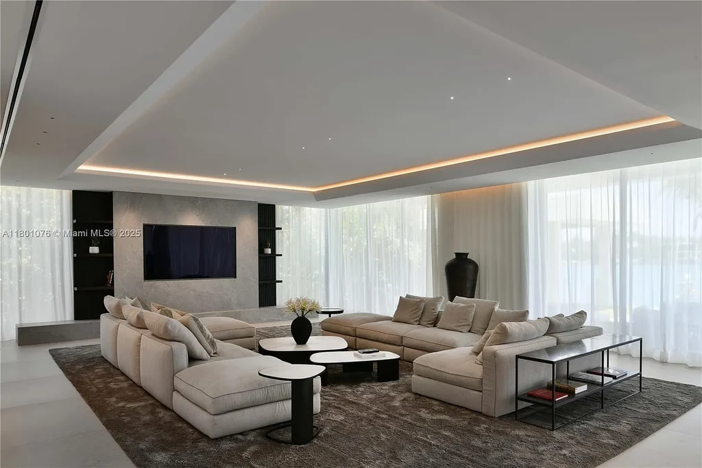 Modern waterfront mansion at 375 N Hibiscus Dr with sleek architecture and bayfront views