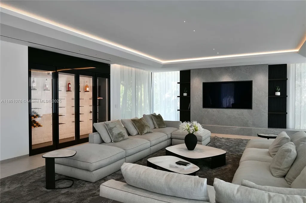 Modern waterfront mansion at 375 N Hibiscus Dr with sleek architecture and bayfront views