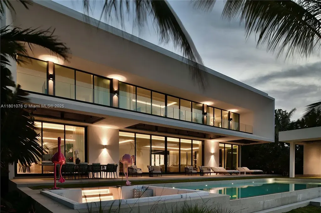Modern waterfront mansion at 375 N Hibiscus Dr with sleek architecture and bayfront views