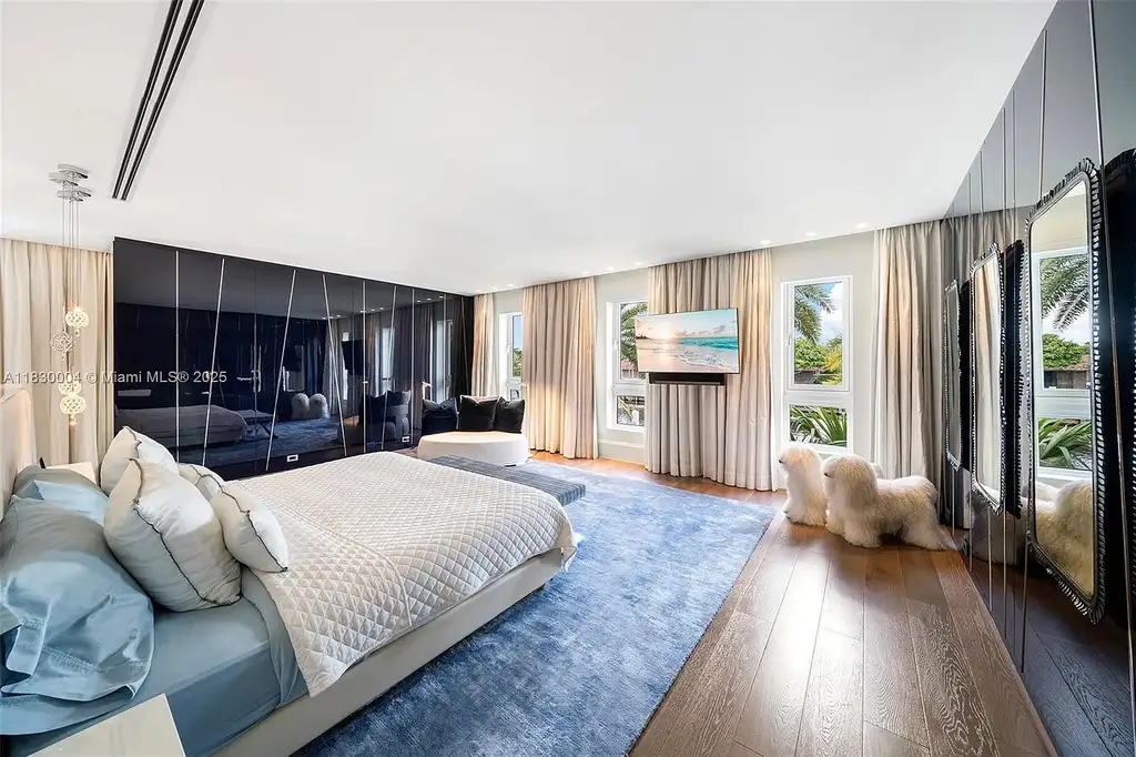 Luxurious primary suite with spa bathroom and bayfront terrace in Coral Gables home for sale