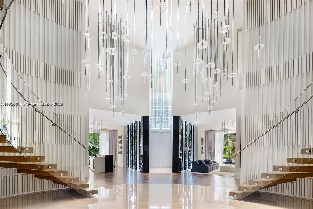 Luxurious primary suite with spa bathroom and bayfront terrace in Coral Gables home for sale