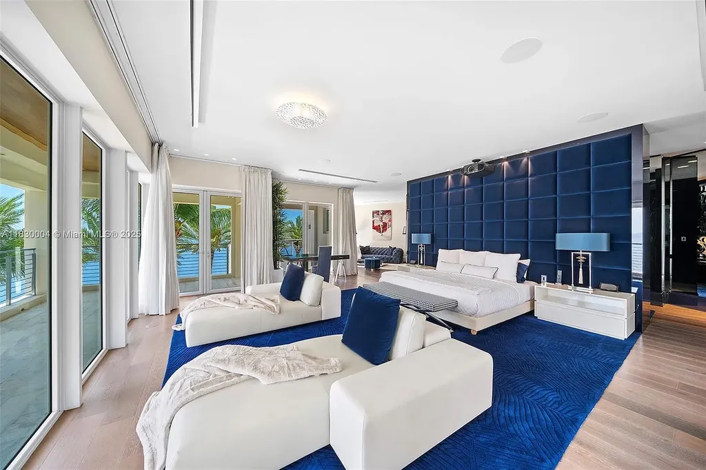 Luxurious primary suite with spa bathroom and bayfront terrace in Coral Gables home for sale