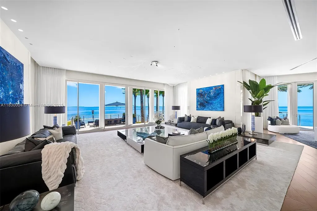 Luxurious primary suite with spa bathroom and bayfront terrace in Coral Gables home for sale