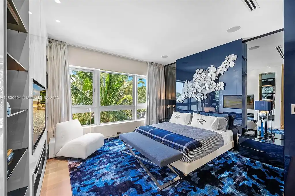 Luxurious primary suite with spa bathroom and bayfront terrace in Coral Gables home for sale