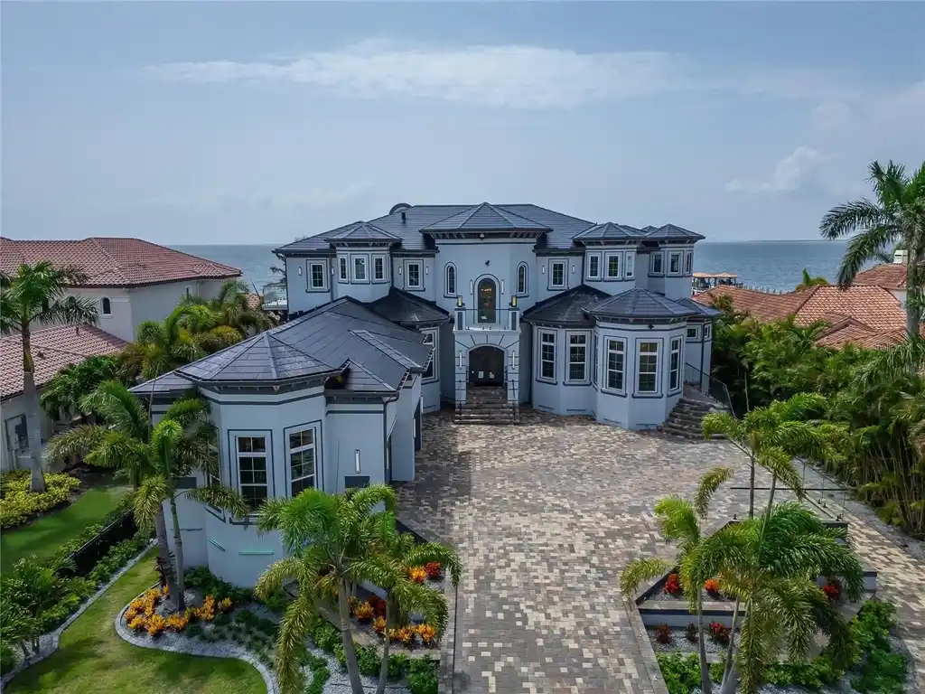 Stunning bayfront exterior of 6526 Surfside Blvd in Apollo Beach, showcasing modern design and private dock access