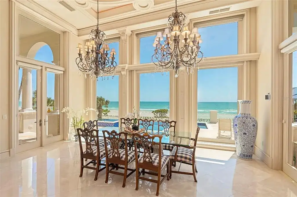 Aerial view of 845 Longboat Club Rd showcasing the estate's beachfront location in Longboat Key, Florida