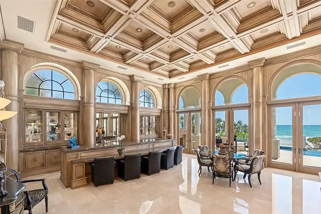 Aerial view of 845 Longboat Club Rd showcasing the estate's beachfront location in Longboat Key, Florida