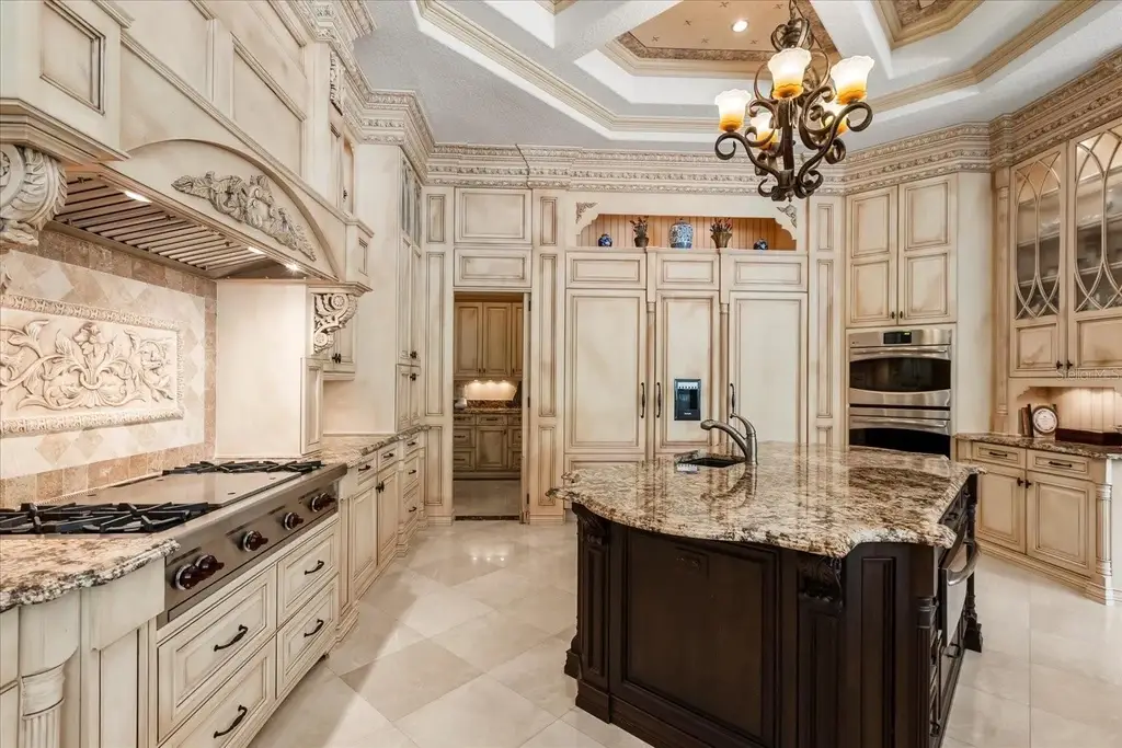 Luxury estate at 8590 Apache Trl in Kissimmee, Florida with Mediterranean design, private gate, and lush 5-acre landscape.