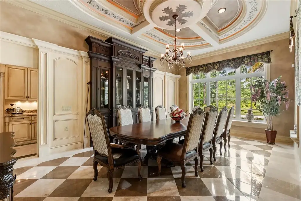 Luxury estate at 8590 Apache Trl in Kissimmee, Florida with Mediterranean design, private gate, and lush 5-acre landscape.
