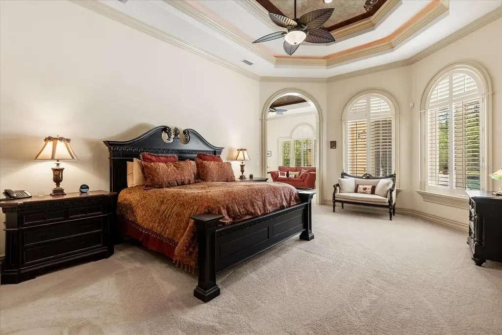 Luxury estate at 8590 Apache Trl in Kissimmee, Florida with Mediterranean design, private gate, and lush 5-acre landscape.
