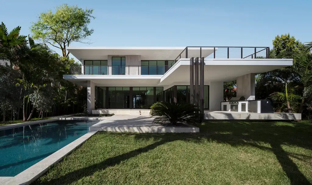 99 Residence in Bay Harbor by SDH Studio A Tropical Modern Home Framing Water Light and Family Living 1