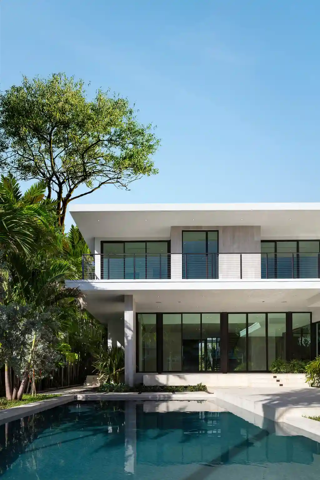 99 Residence in Bay Harbor by SDH Studio, A Tropical Modern Home Framing Water, Light, and Family Living