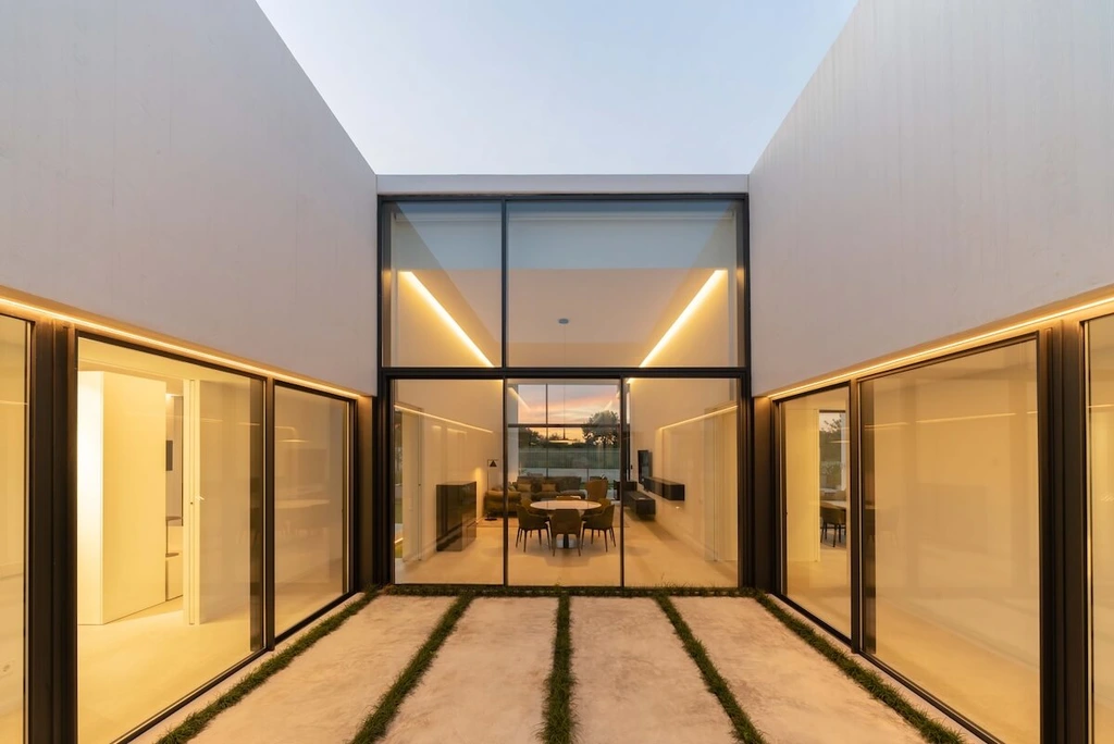 Oriol House by Ruben Muedra A Sculptural White Concrete Retreat Overlooking a Valencian Golf Course 2