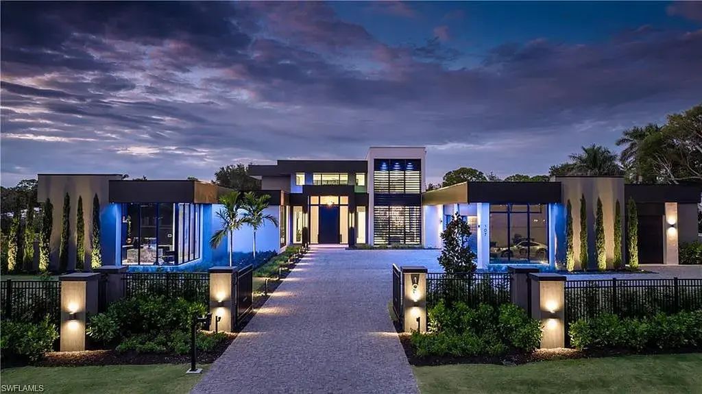 Luxury estate at 107 Myrtle Rd, Naples featuring 5 bedrooms, guest house, lap pool, smart Control4 system, and modern architecture on 1.12-acre lot