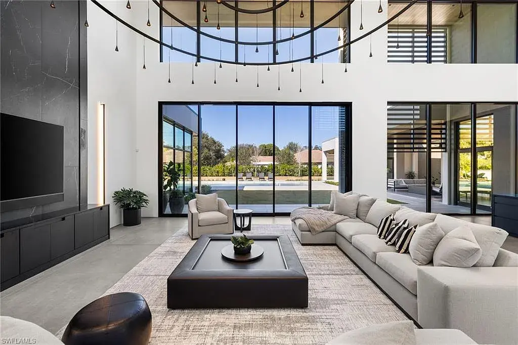 Luxury estate at 107 Myrtle Rd, Naples featuring 5 bedrooms, guest house, lap pool, smart Control4 system, and modern architecture on 1.12-acre lot