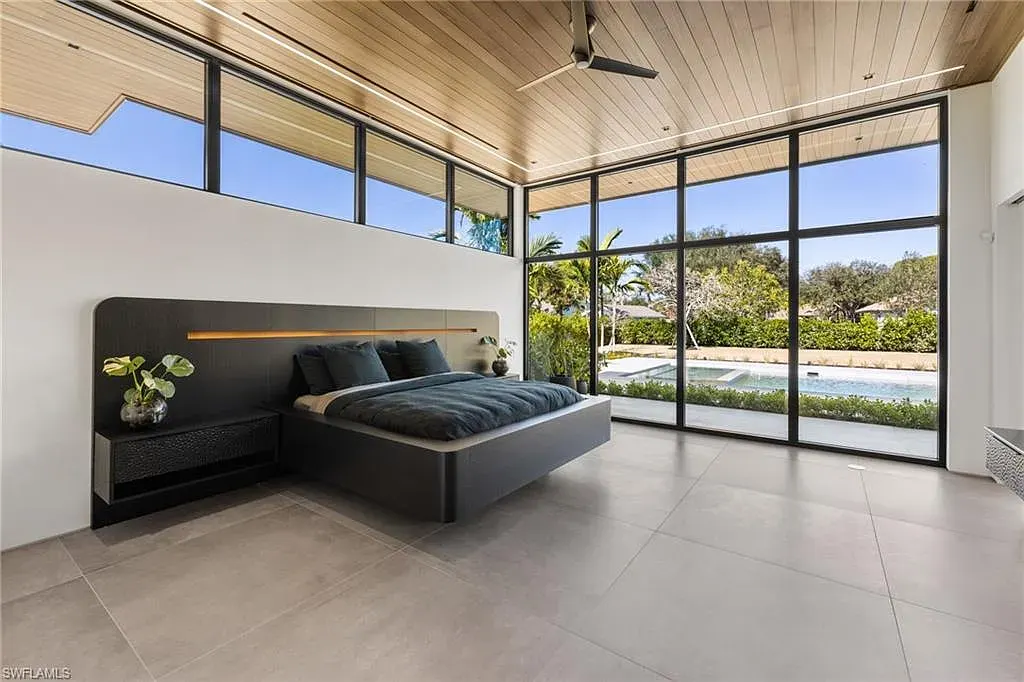 Luxury estate at 107 Myrtle Rd, Naples featuring 5 bedrooms, guest house, lap pool, smart Control4 system, and modern architecture on 1.12-acre lot