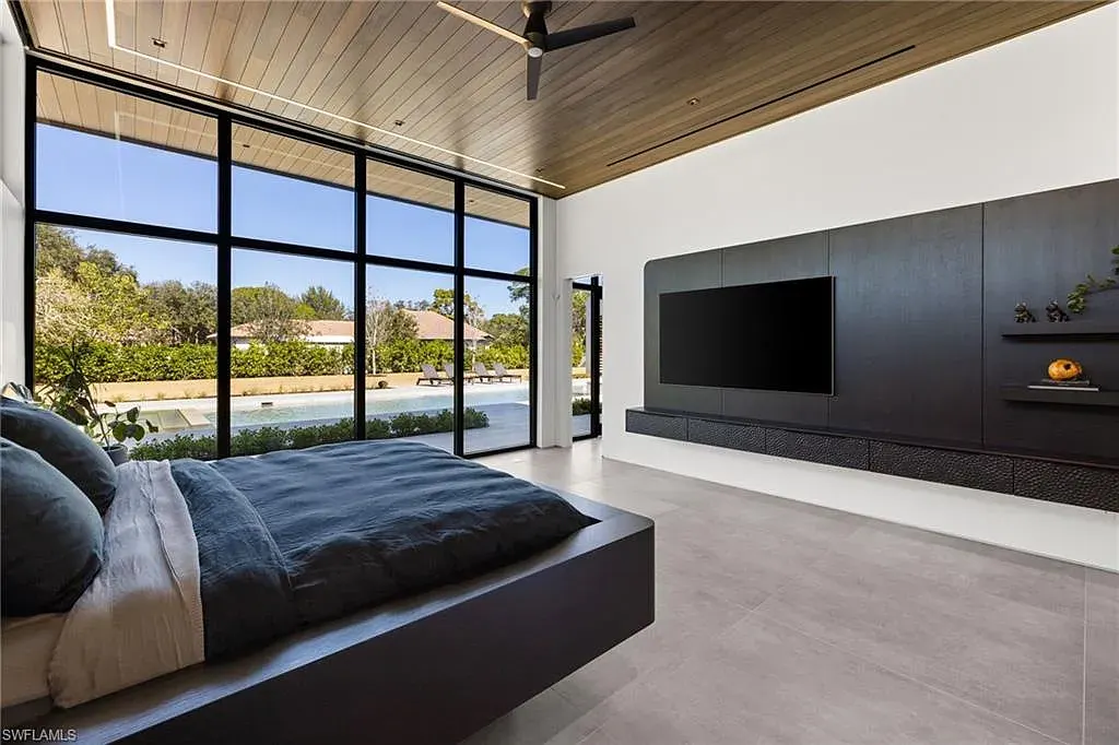 Luxury estate at 107 Myrtle Rd, Naples featuring 5 bedrooms, guest house, lap pool, smart Control4 system, and modern architecture on 1.12-acre lot