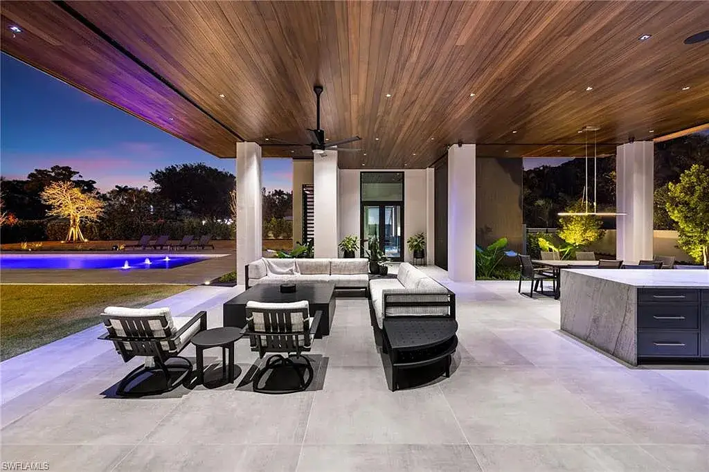 Luxury estate at 107 Myrtle Rd, Naples featuring 5 bedrooms, guest house, lap pool, smart Control4 system, and modern architecture on 1.12-acre lot