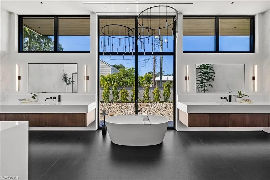 Luxury estate at 107 Myrtle Rd, Naples featuring 5 bedrooms, guest house, lap pool, smart Control4 system, and modern architecture on 1.12-acre lot