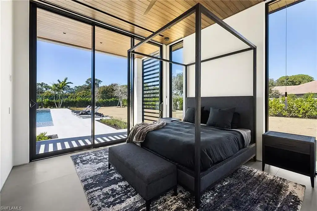 Luxury estate at 107 Myrtle Rd, Naples featuring 5 bedrooms, guest house, lap pool, smart Control4 system, and modern architecture on 1.12-acre lot