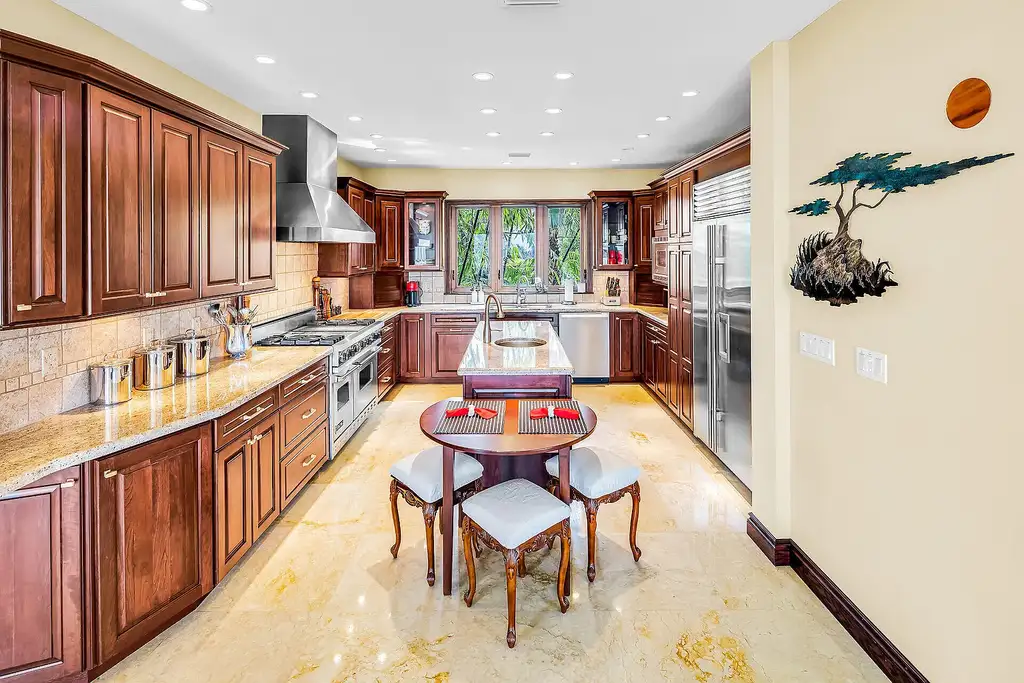 Luxury pool with waterfall overlooking Florida Bay at 1112 Venetian Blvd in Venetian Shores
