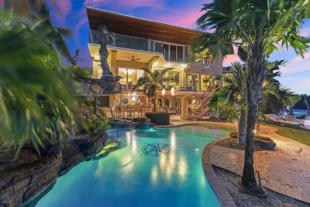 Luxury pool with waterfall overlooking Florida Bay at 1112 Venetian Blvd in Venetian Shores