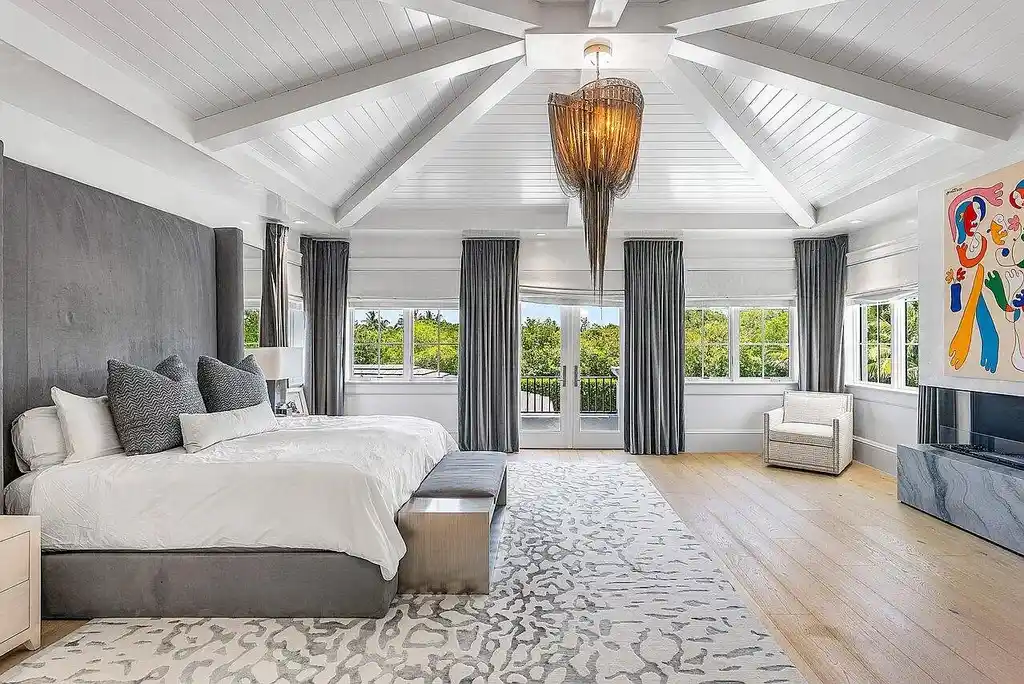 Luxury estate at 1162 Banyan Estates Drive with infinity pool, tropical landscape, and modern design in gated Seminole Landing, North Palm Beach, FL.