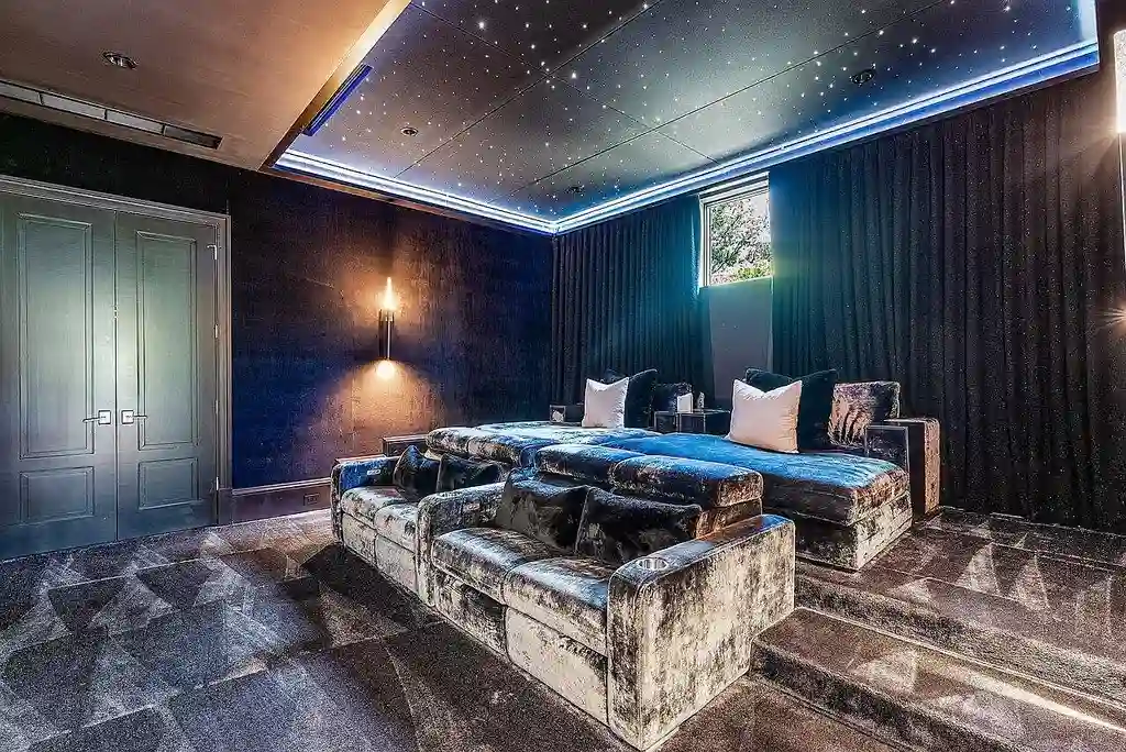 Luxury estate at 1162 Banyan Estates Drive with infinity pool, tropical landscape, and modern design in gated Seminole Landing, North Palm Beach, FL.