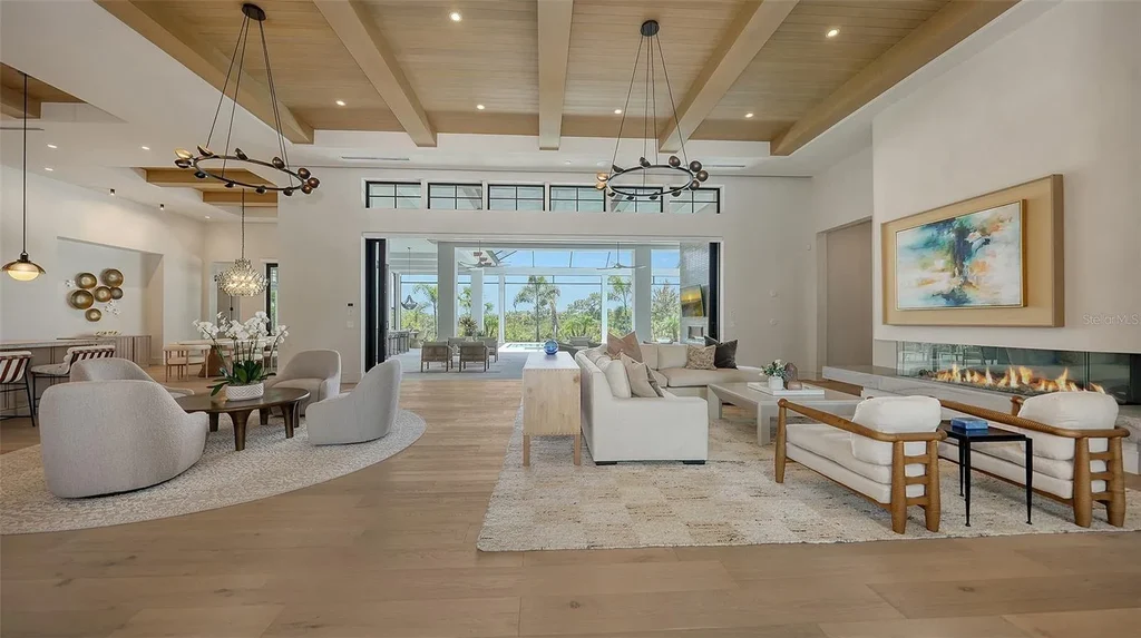 Front façade of 15315 Anchorage Pl showcasing smart-glass entry and contemporary Florida architecture framed by lush landscaping.