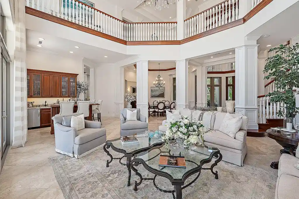 Aerial view of 2365 Azure Circle showing saltwater pool, waterfront dock, and lush landscaping in Palm Beach Gardens Real Estate