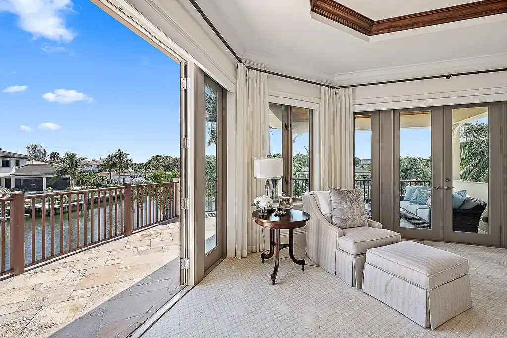 Aerial view of 2365 Azure Circle showing saltwater pool, waterfront dock, and lush landscaping in Palm Beach Gardens Real Estate