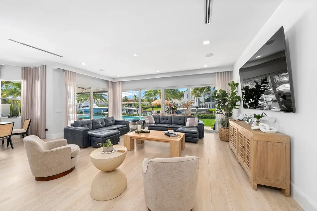 Front exterior of 2900 NE 23 Place Pompano Beach with lush landscaping and circular driveway