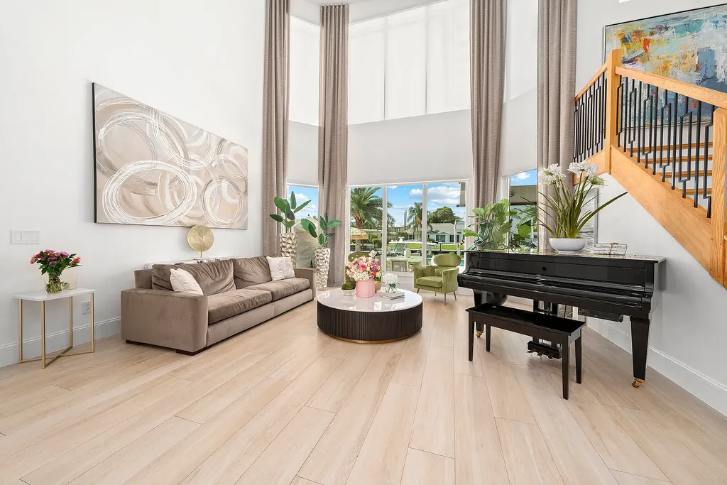 Front exterior of 2900 NE 23 Place Pompano Beach with lush landscaping and circular driveway